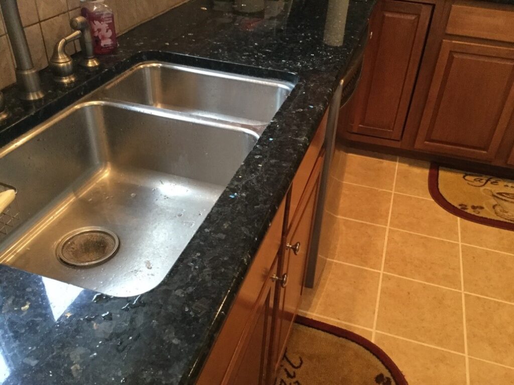 kitchen sink falling down from granite