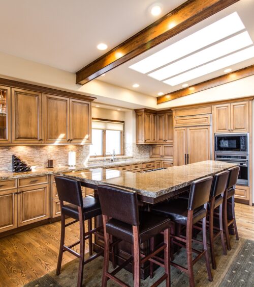 home-3593730_1920 Traditional oak kitchen with granite countertops, a seated island and a beamed skylight