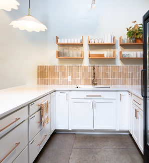 Quartz countertop kitchen with open shelving and tile backsplash