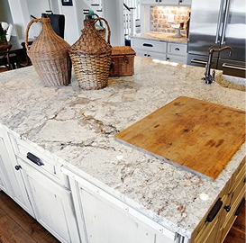 Granite countertop styled with kitchen decor and cutting board