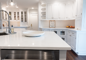 White quartz countertop with custom kitchen cabinetry