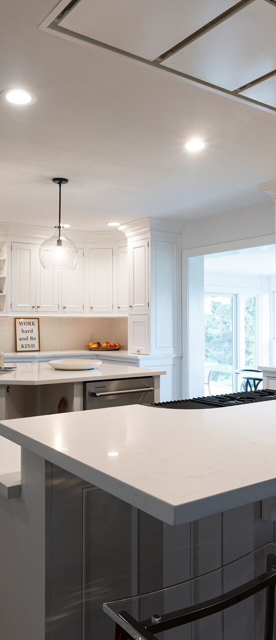 Quartzite waterfall island countertop with pendant lighting