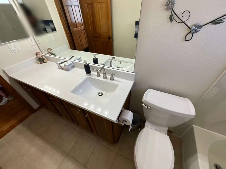 Remodeled bathroom vanity and countertop viewed from the doorway