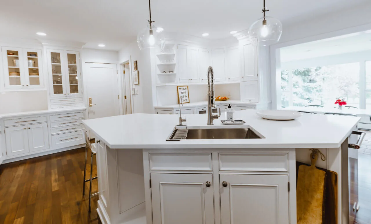Quartz waterfall countertop island in a Denver kitchen remodel