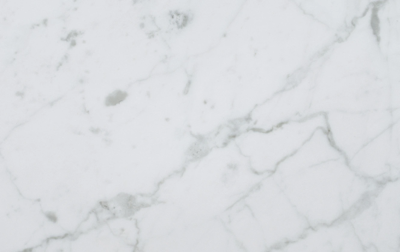 White quartz slab with soft gray veining available at Kitchen and Bath by Design in Denver